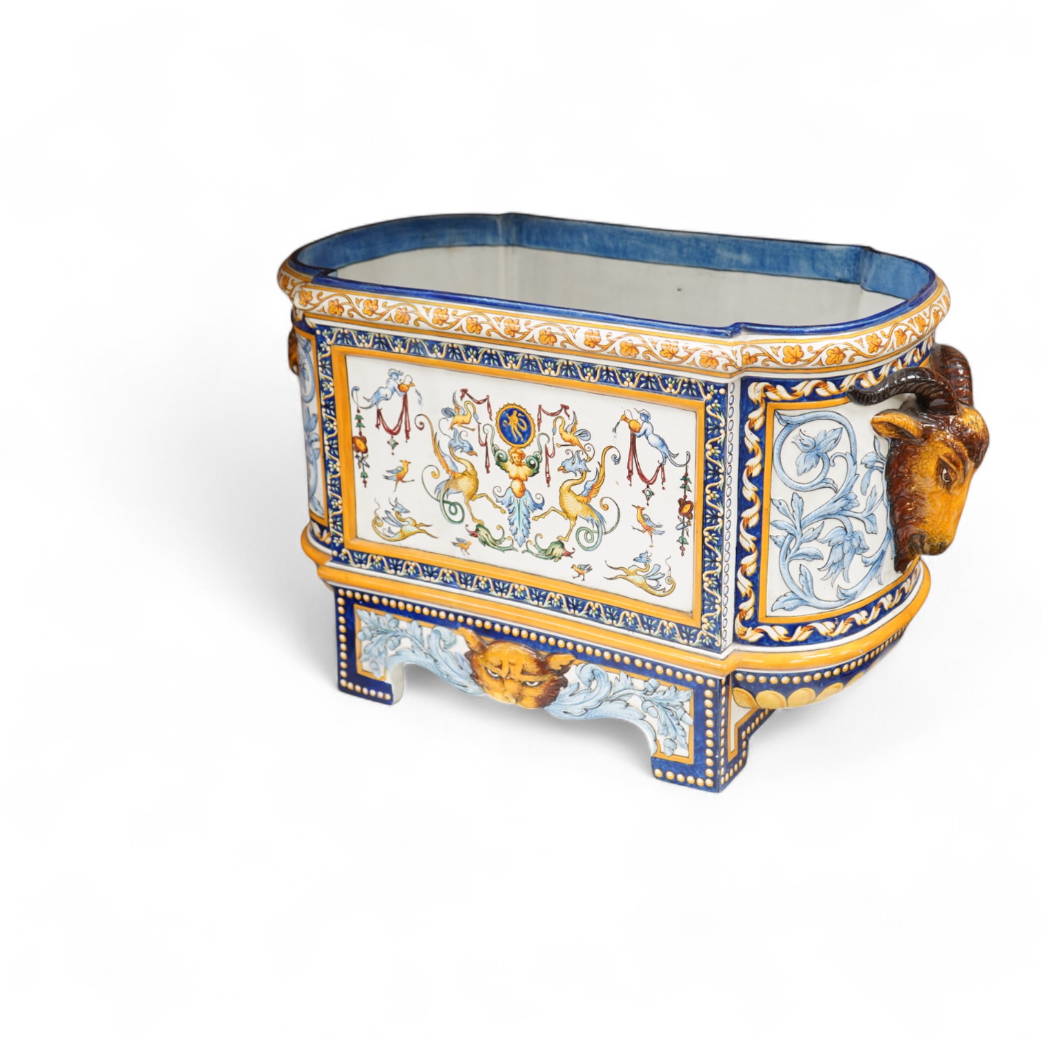 A large 19th century French faience wine cooler or planter with ram’s head handles, 60cm wide